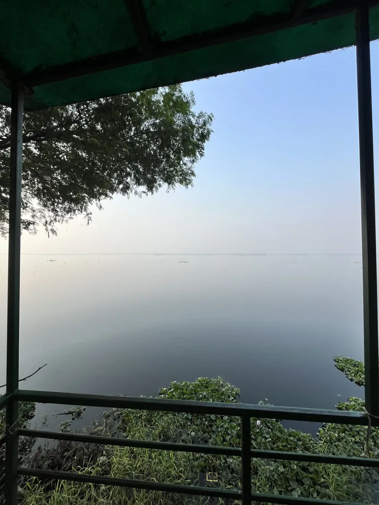 View of the Yamuna river reservoir from a viewing deck at Okhla bird sanctuary, Noida